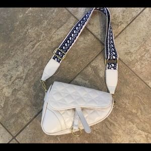 Cream saddle cross body bag